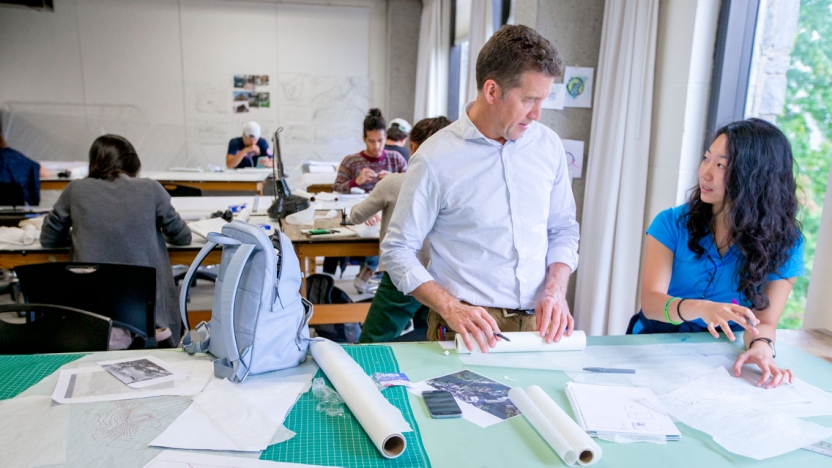 A professor and student work together in the architecture studio.