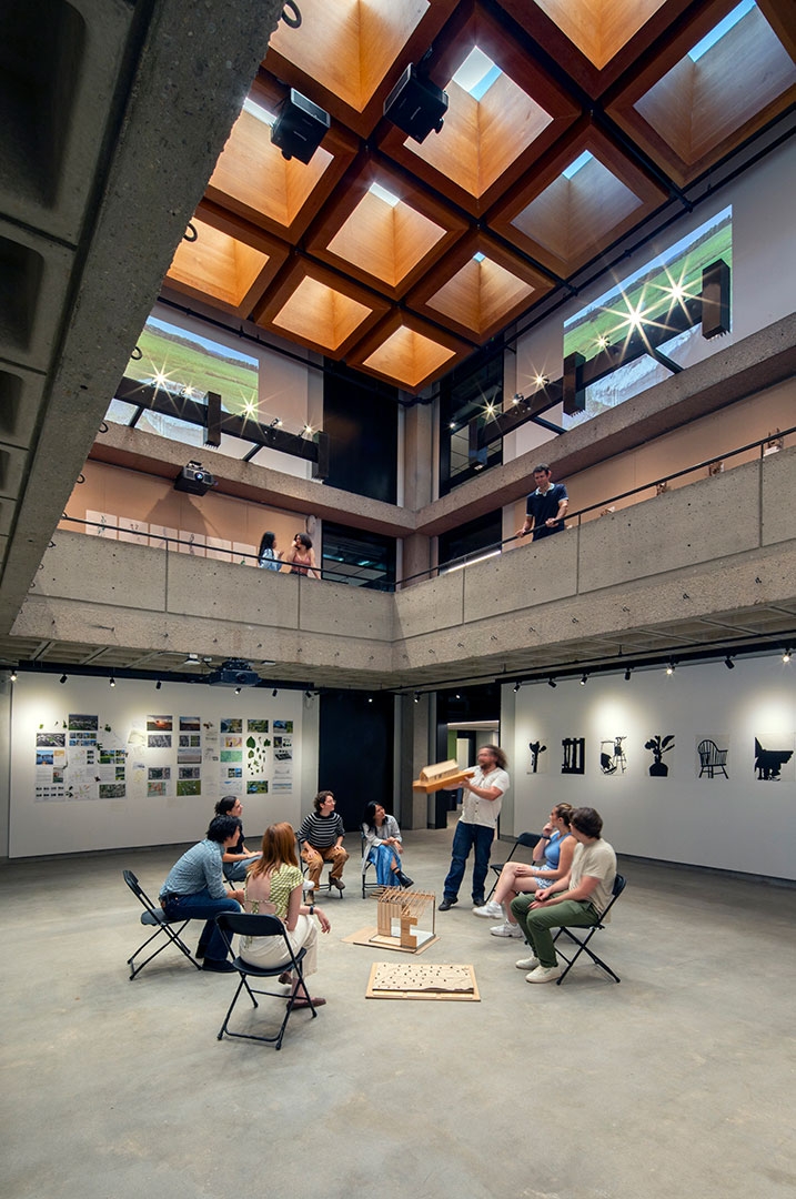 An architecture studio meets in the atrium.