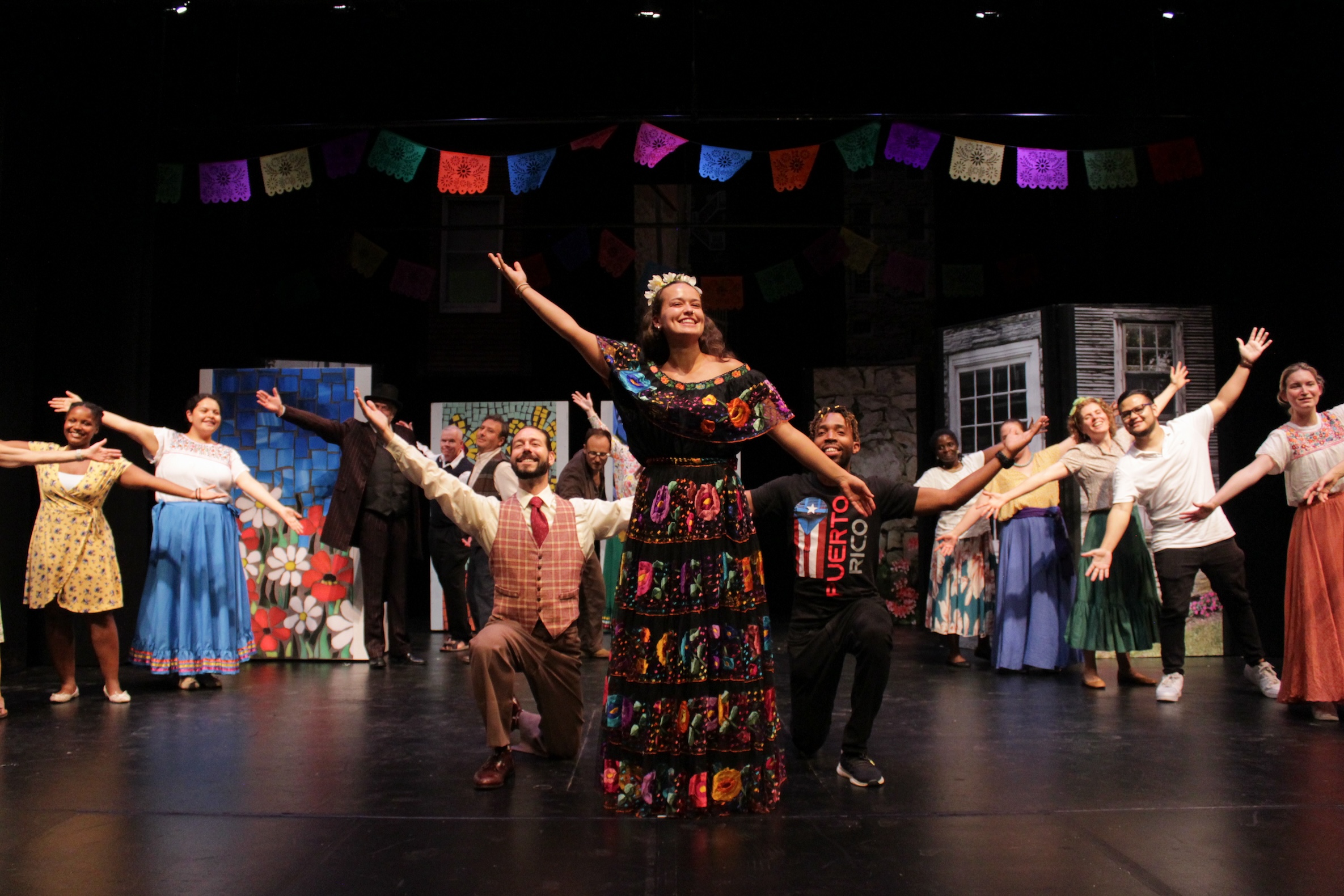 A group performs a play onstage.