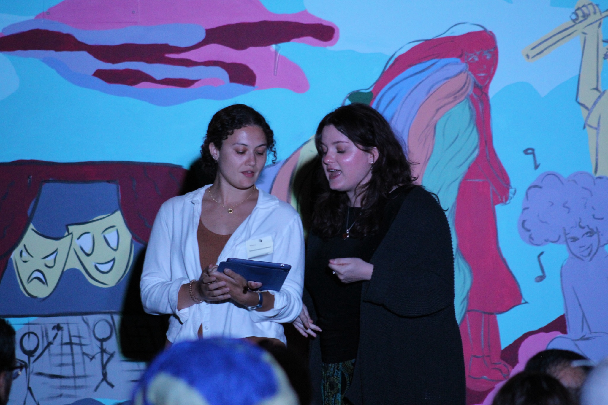 Students perform onstage.