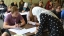 Students learning Arabic lettering.