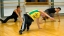 Three Portuguese school students learn dance.