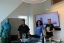 Students present at the front of the classroom.