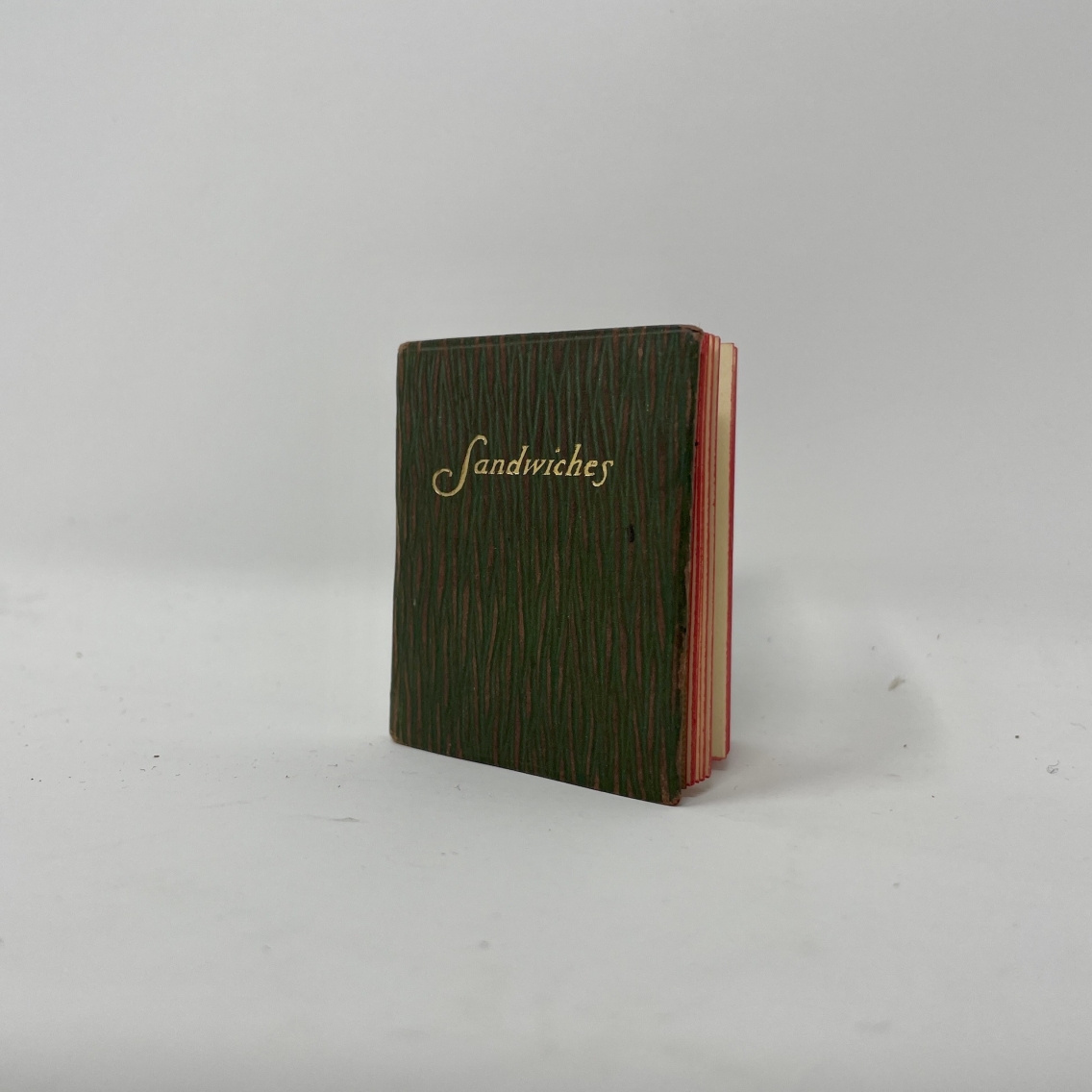 tiny book with "sandwiches" in gold lettering on cover