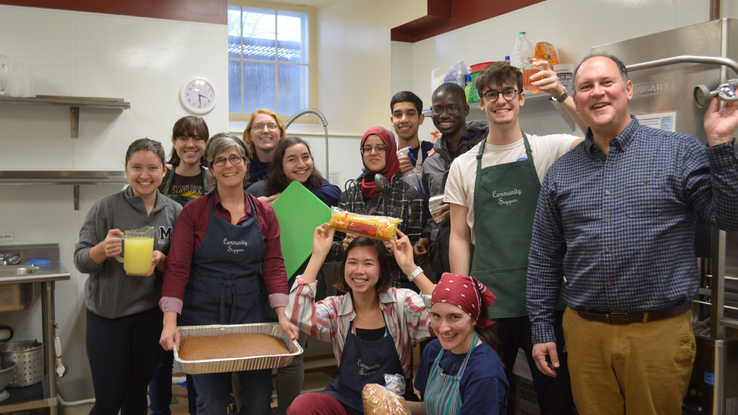 Staff and students working at the Community Supper at a local church.