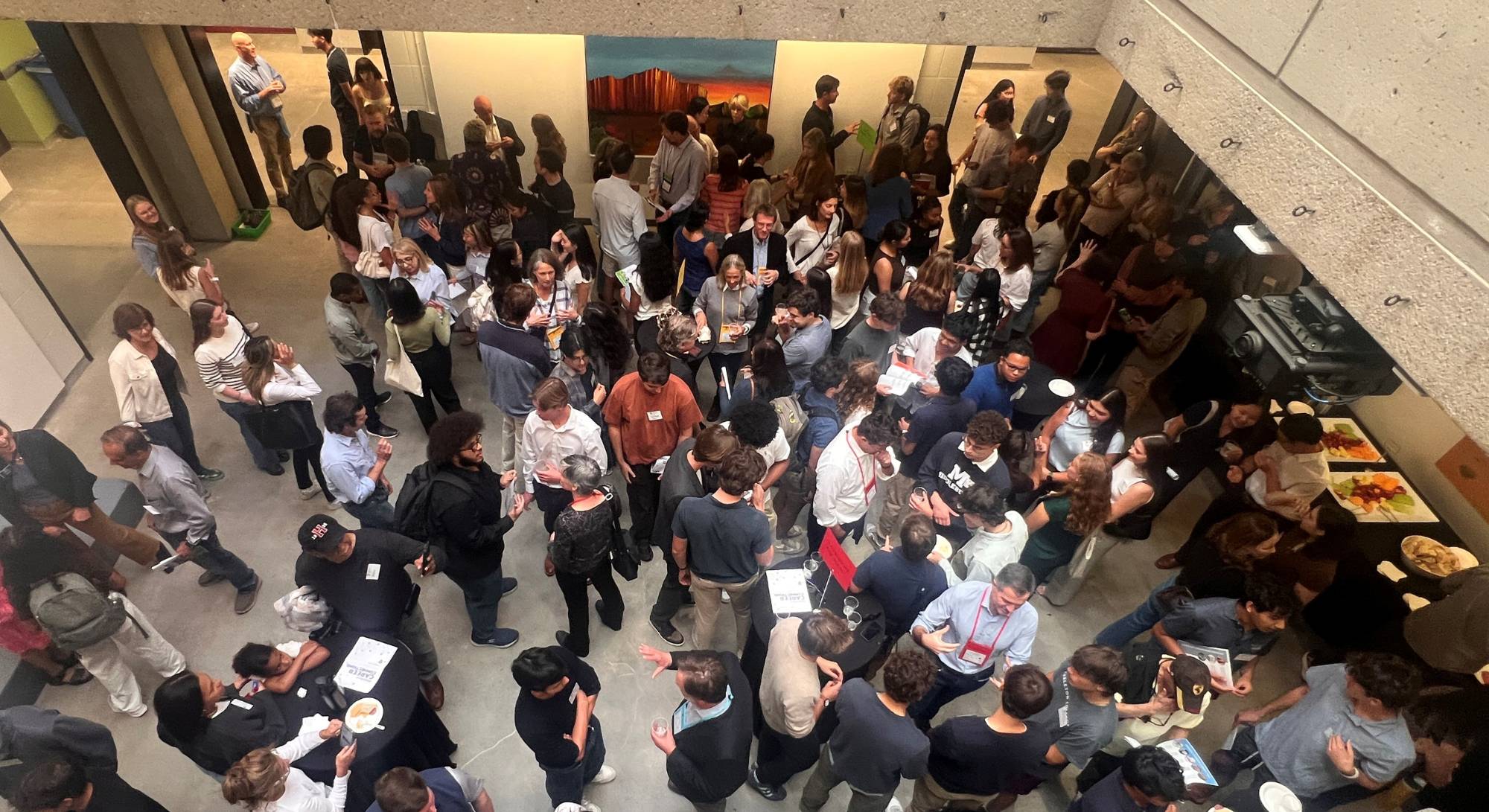 A photo of the group of parents, alumni, and students networking.