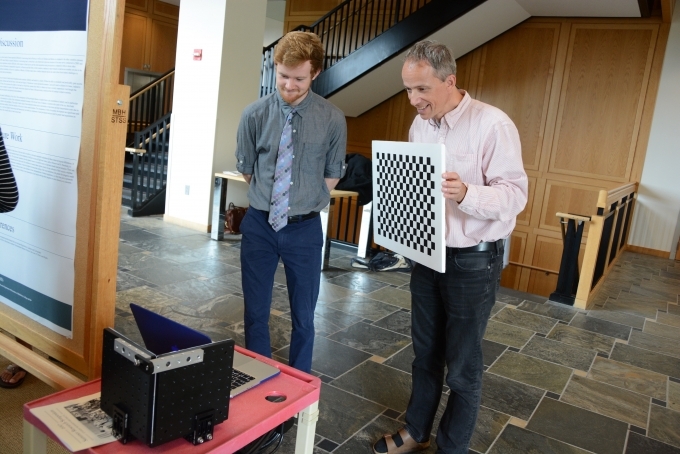 Kyle Meredith ’19, a computer science major, demonstrates his project to mentor Daniel Scharstein, professor of computer science. 