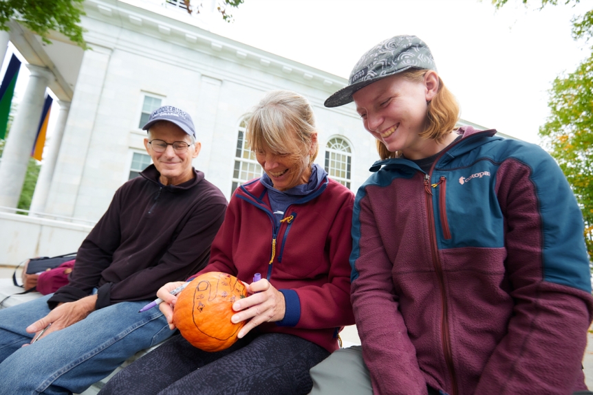 Parents and students decorate pumpkins during Fall Family Weekend 2023