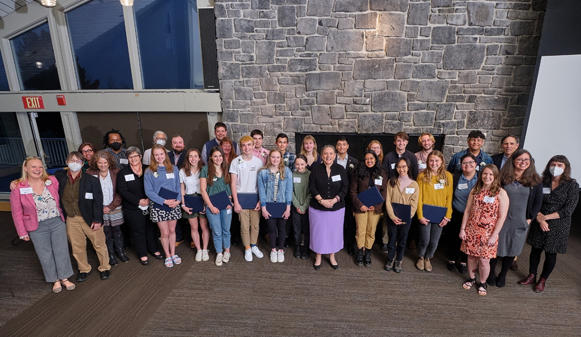 Students pose for a group photo with President Laurie Patton at the Public Service Leadership Awards.