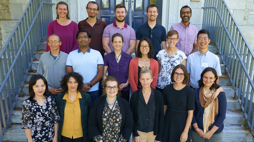 Photo of new faculty members posing for a group photo during faculty orientation.