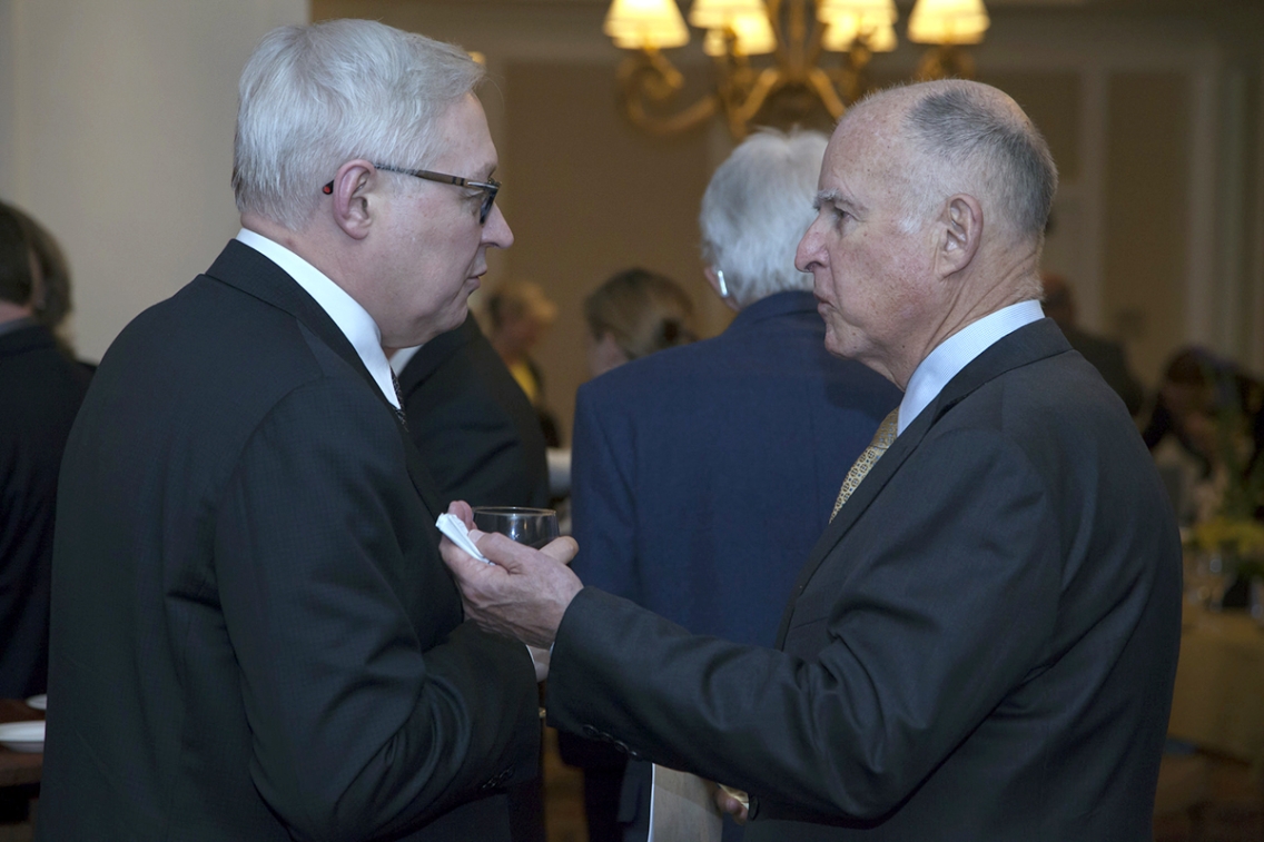 California Governor Jerry Brown speaks with Russian Deputy Foreign Minister Sergey Ryabkov.