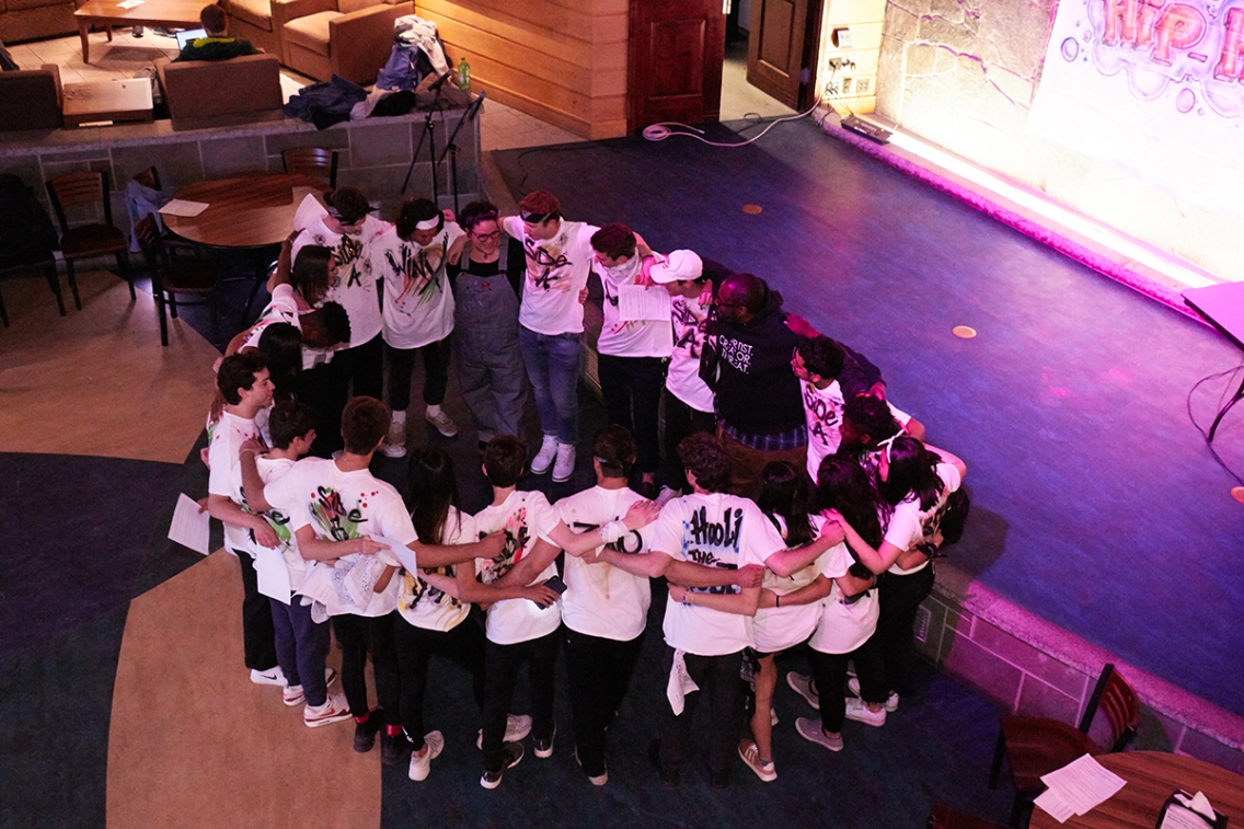 Students gather together before their show. During the performance, they split into two friendly rivalries: Side A and Side B.