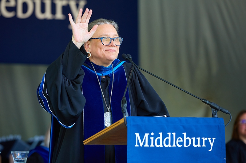 President Laurie Patton waves from the podium.