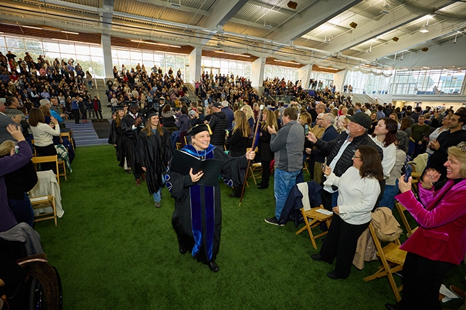 President Laurie Patton leads an academic procession.