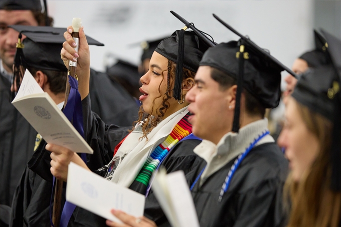 Students sing the College alma mater during Feb Celebration.