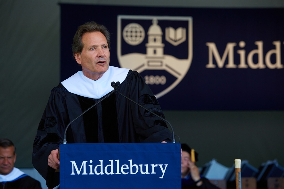Commencement speaker Dan Schulman stands at the podium to give his address.