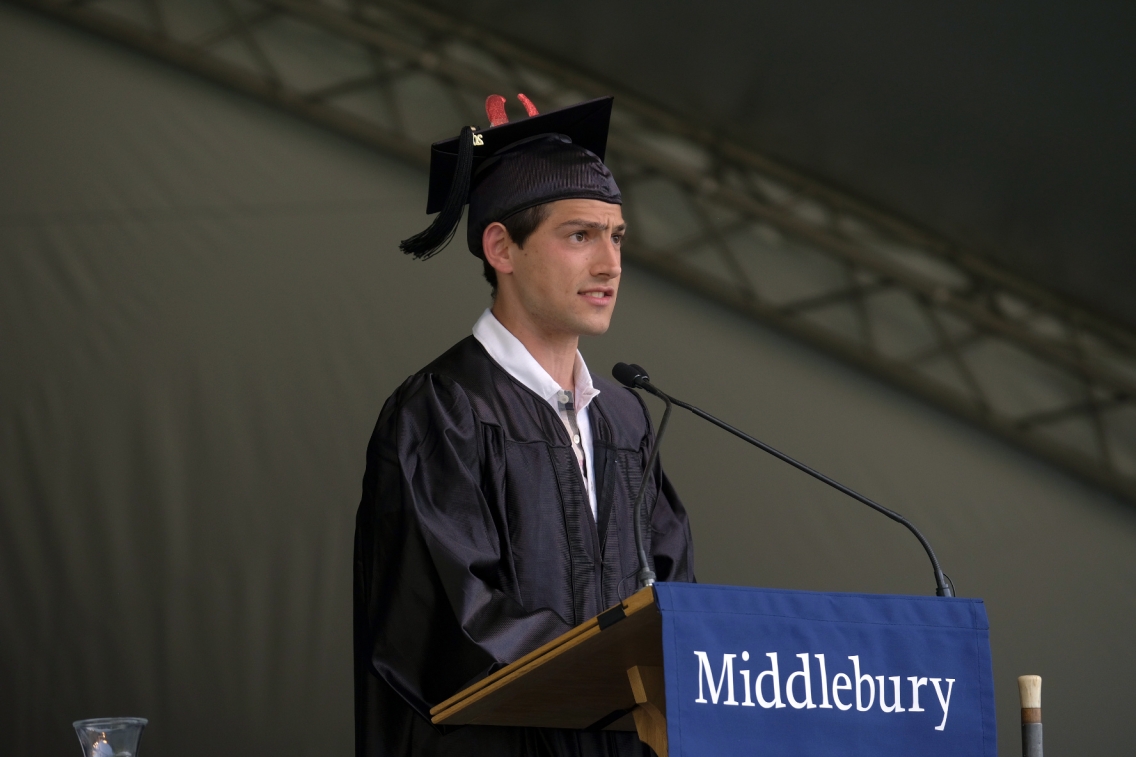 A student stands at the podium to deliver the student Commencement address.