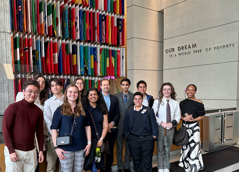 Group of students poses for a photo at the World Bank in D.C.