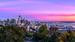 aerial view of Seattle sky- and shoreline, with the Space Needle most prominent