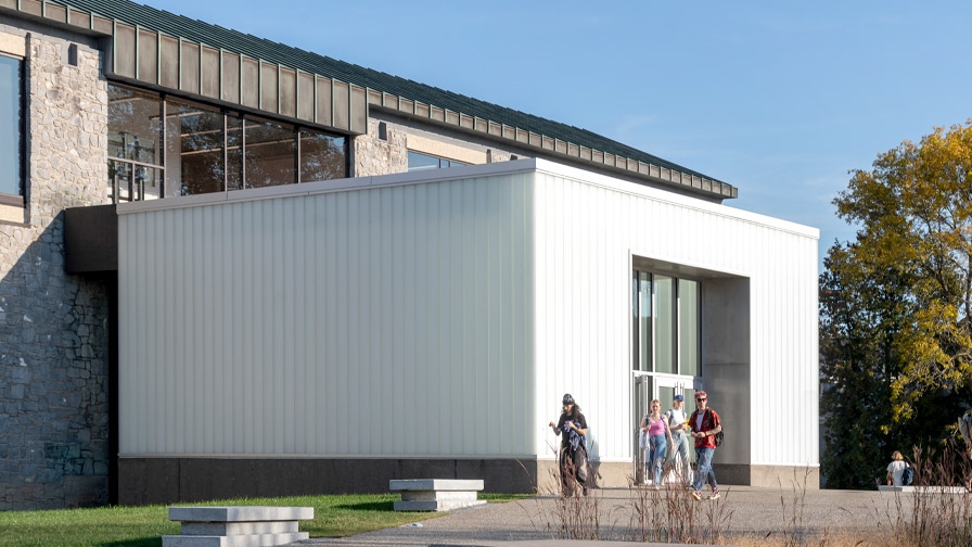 Students walking in front of the Christian A. Johnson Memorial Building