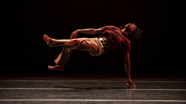 Cameron McKinney ’14 Dancing in a Studio with Moody Orange Lighting