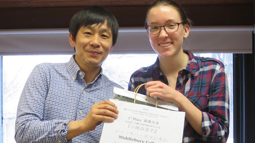 Two students pose with their speech contest award