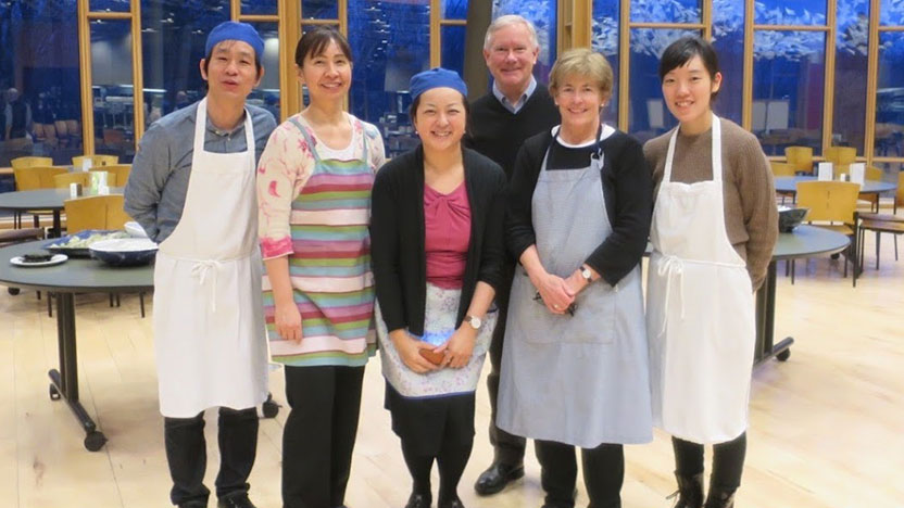 Students and chefs work together to learn the art of sushi making