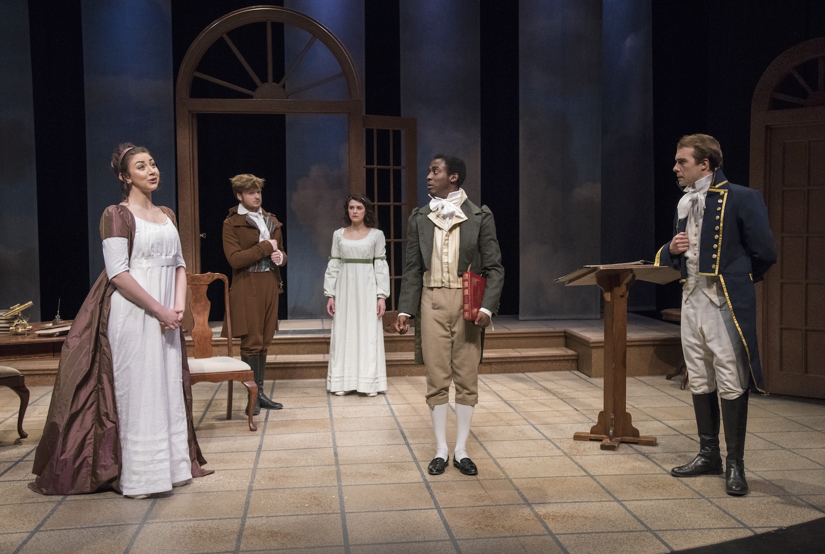 Five actors in fine-clothing discussing