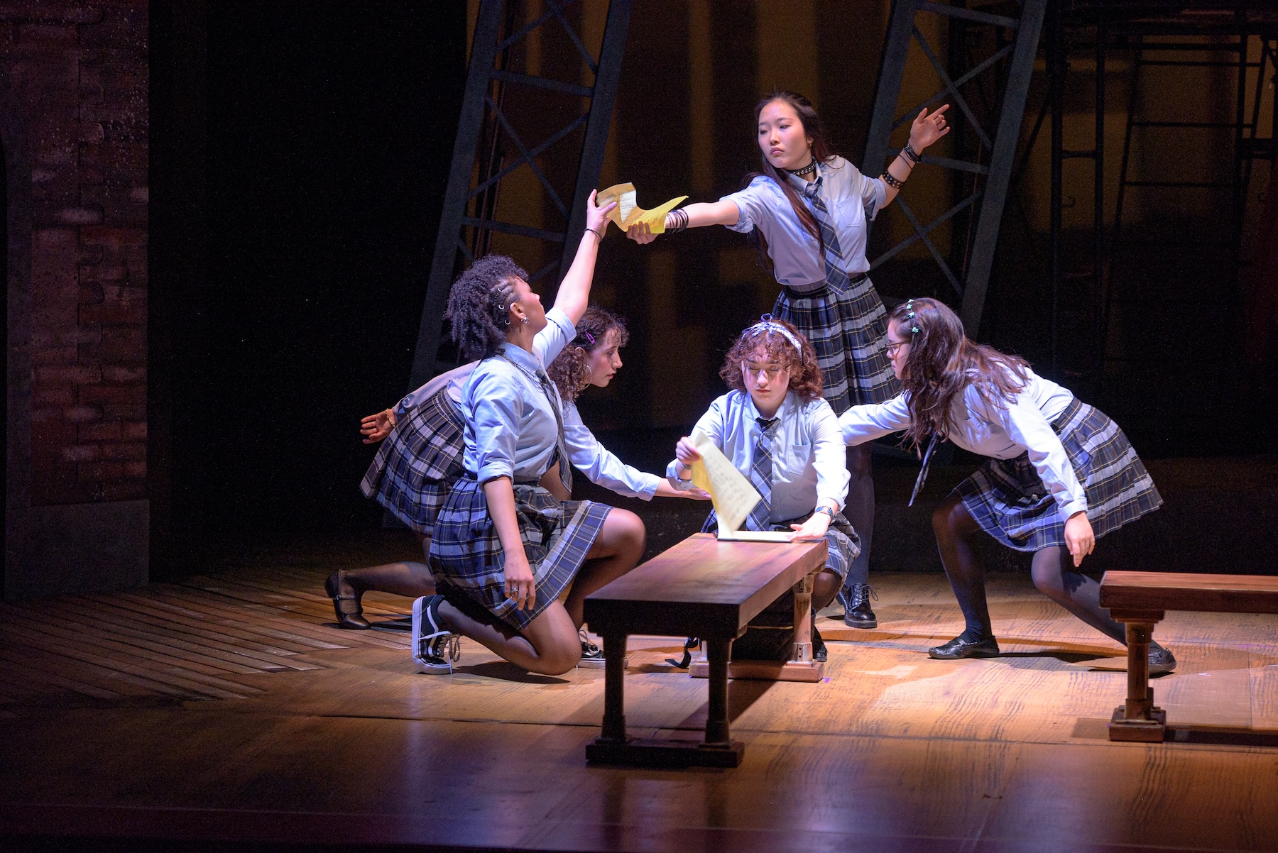 Actors for a choreographed shape around another actor, who is writing