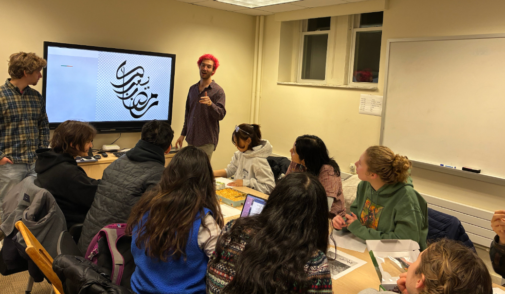 Students learning how to decipher Arabic Calligraphy.