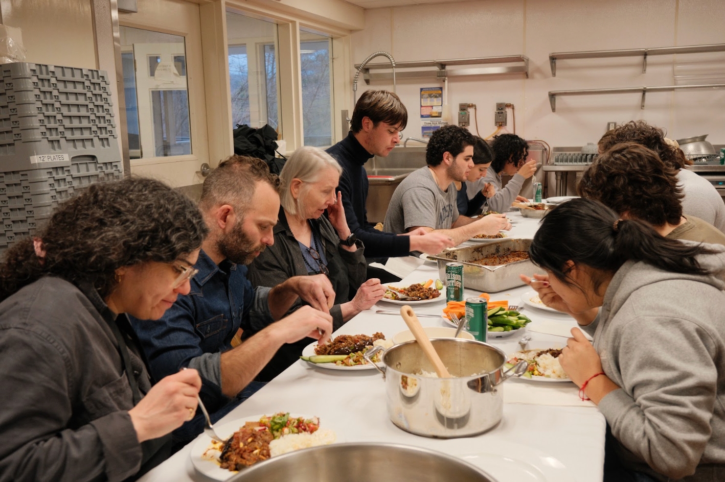The first cooking class enjoys eating their creation.