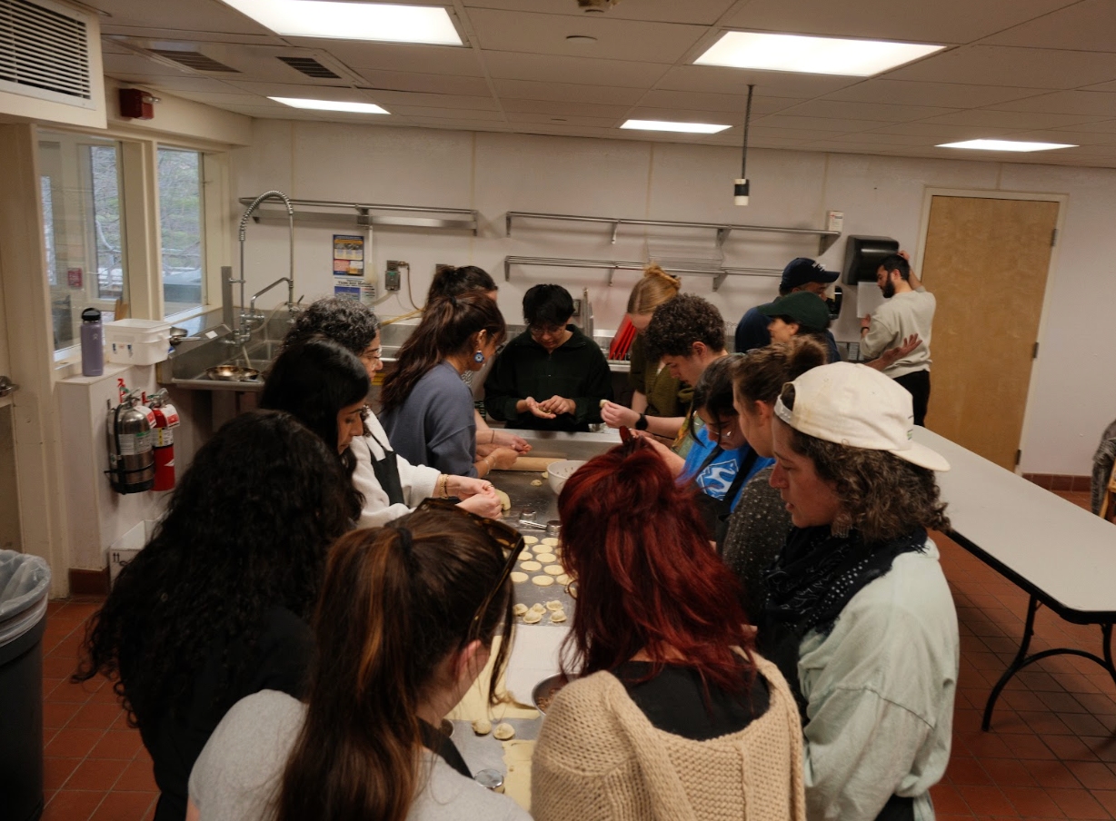 The second cooking class kneading dough together.