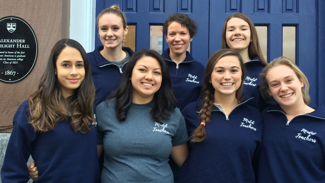 Students pose with faculty at the completion of the project.