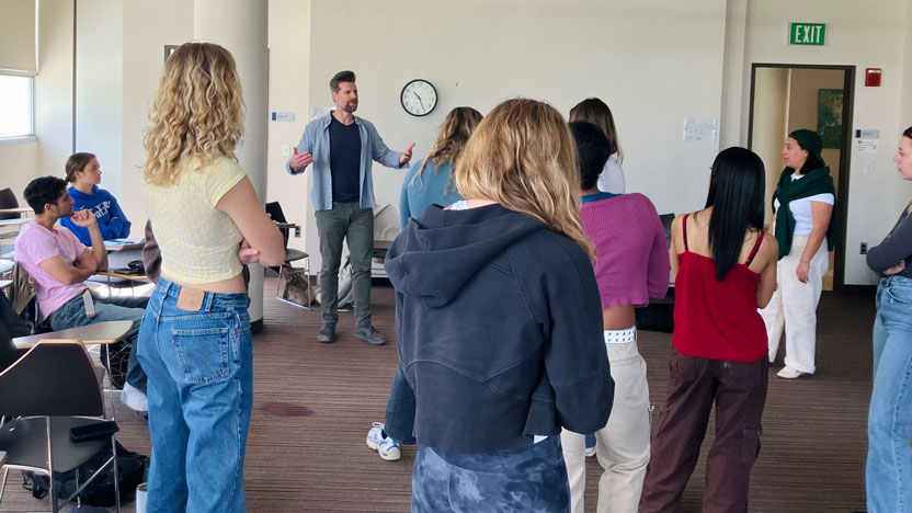 Students in an economics class working with Beyond the Page.