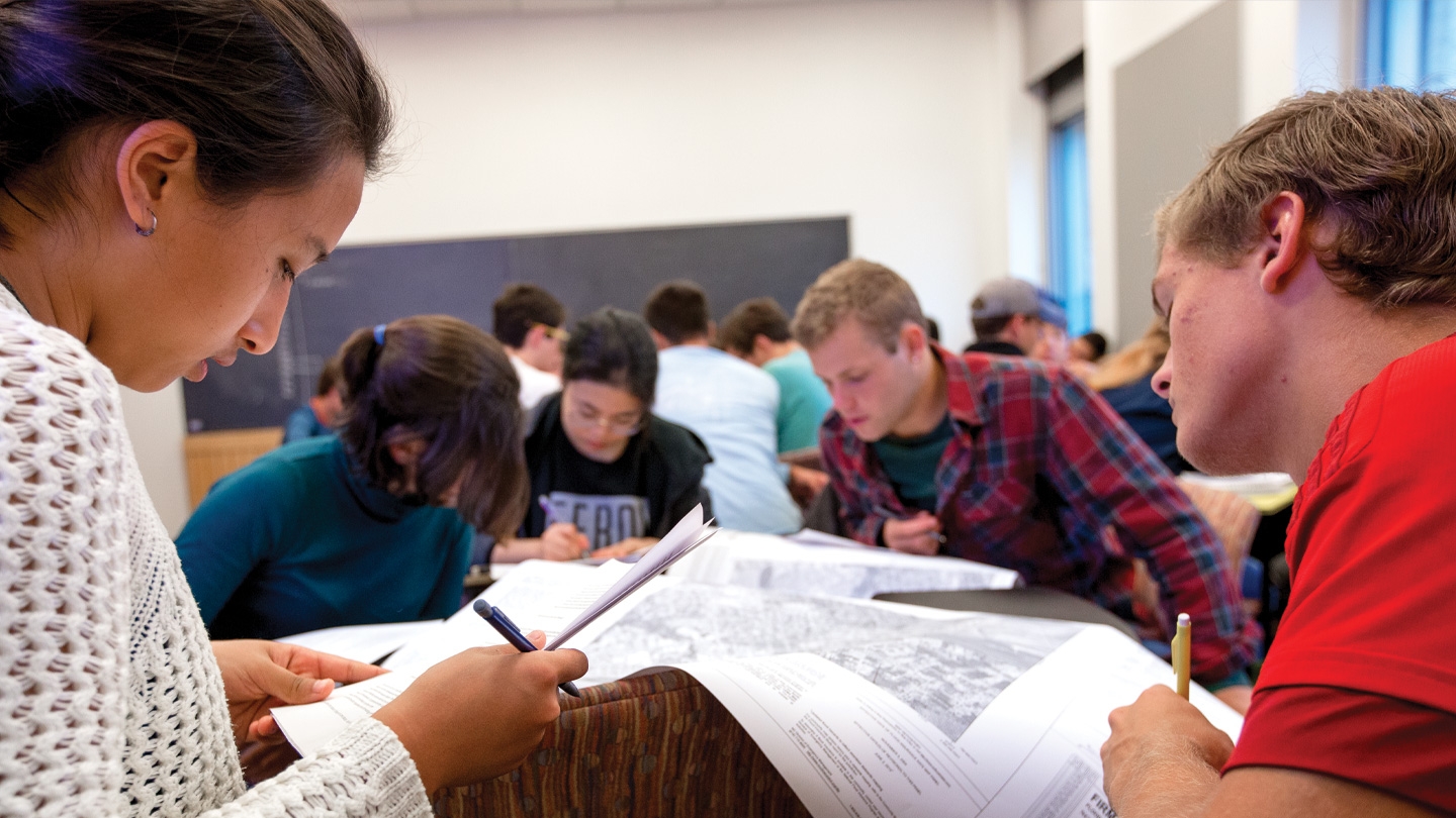 Students collaborating in Geography class.