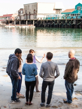 Students talking across from the pier in Monterey