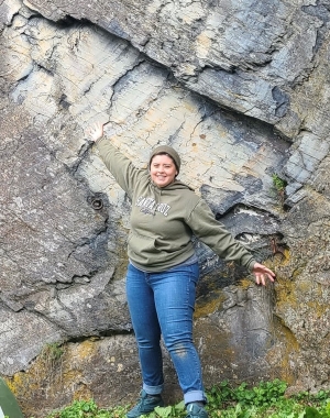 ECSC student and SAC Memeber Julianna Martinez standing in front of exposed rock.