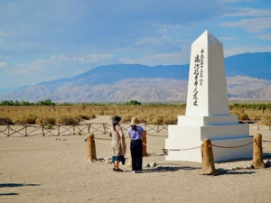student looking at an obelisk