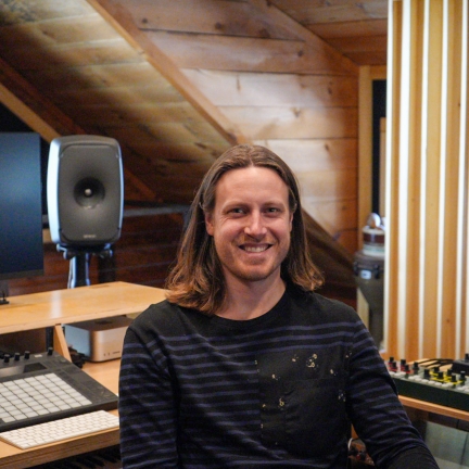 man in front of audio speaker