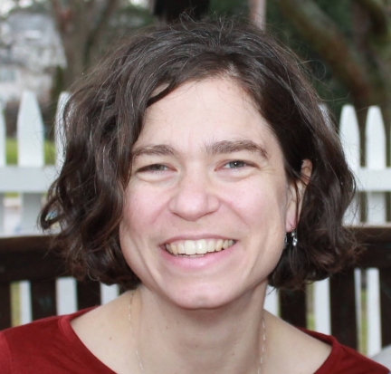 Headshot of white woman with chin-length darkbrown hair