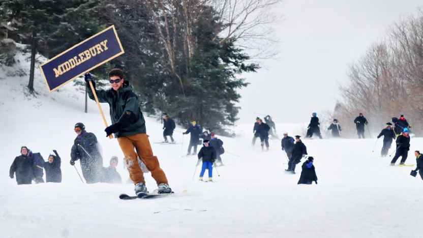 Middlebury College Feb Grads skiing down mountain celebrating graduation