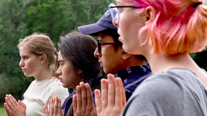 Students participate in a wellness workshop on campus.