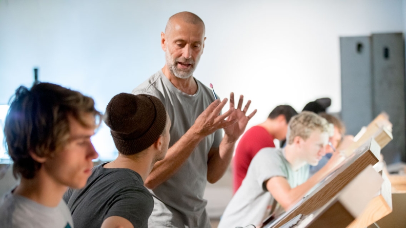 Students working with an art instructor in an animation class.