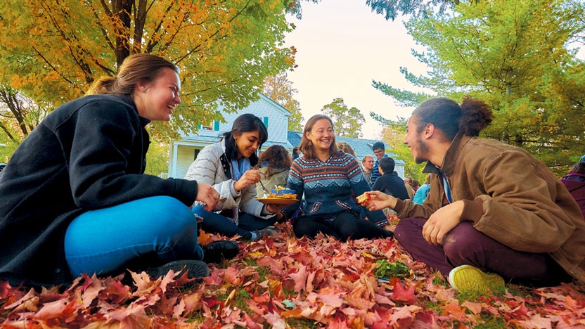 Students outdoors at a fall picnic on campus