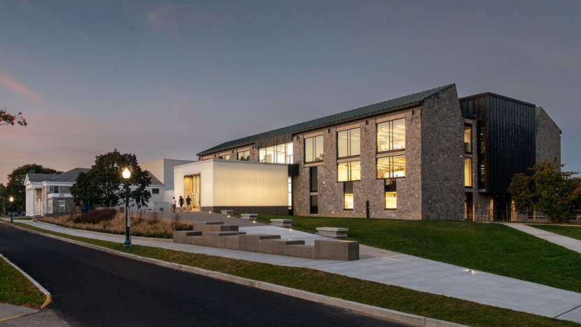 The exterior of the building at dusk.