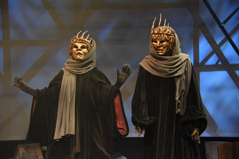 Two actors in traditional Greek theatre masks