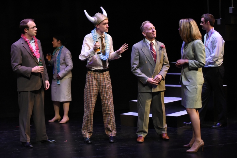 Six actors at a company party, one wearing viking helmet