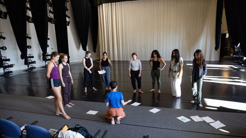A class on the stage in the Dance building.