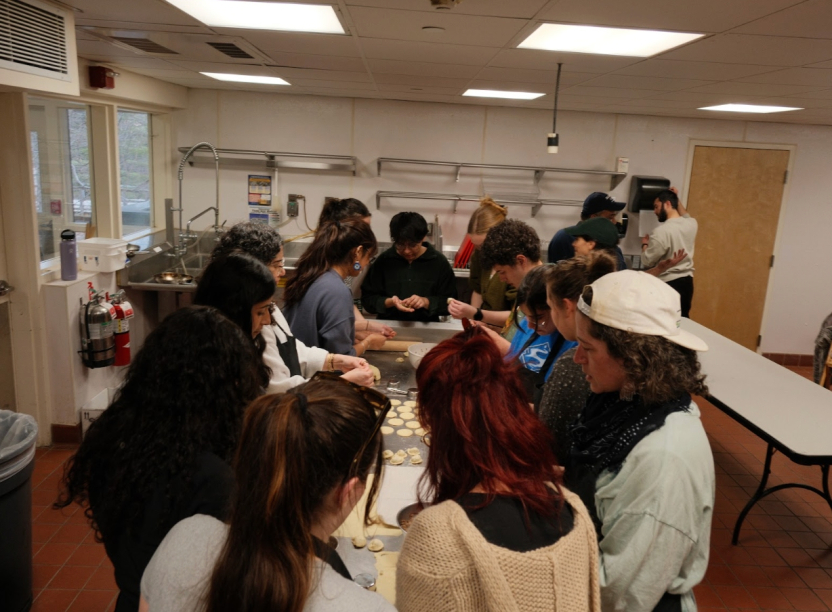 The second cooking class kneading dough together.