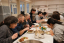 The first cooking class enjoys eating their creation.